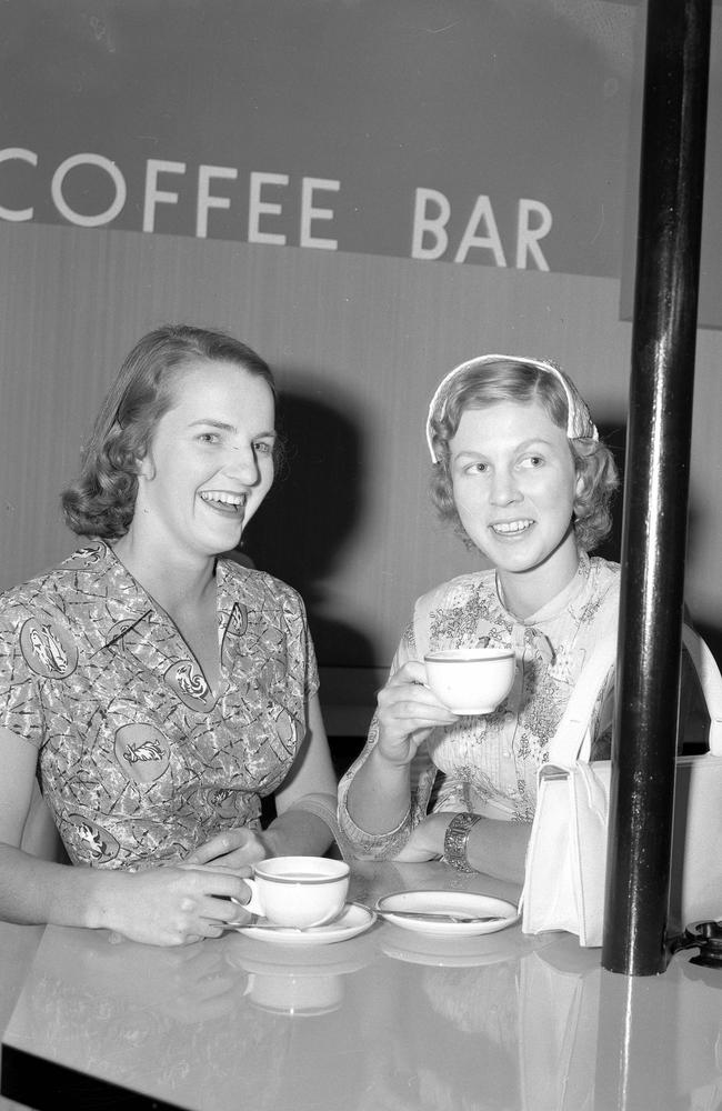 News 5/11/1956 Sally Tylance, left, and Beth Hopkinson try one of the first coffee bars in Brisbane at the Penney’s Building. Neg/no K9485 Picture by Bob Millar jnr. The Courier-Mail Photo Archive Scanned March/2009