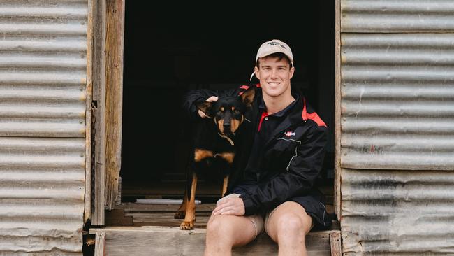 Study break: University of Melbourne agriculture student Bill Lee with his Kelpie, Benny, on his family farm at Birchip. Picture: Chloe Smith