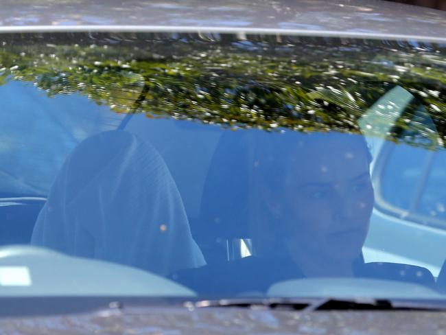 A woman believed to be Maha Al-Shennag is taken from Bankstown hospital in an unmarked police car yesterday. Picture: John Grainger