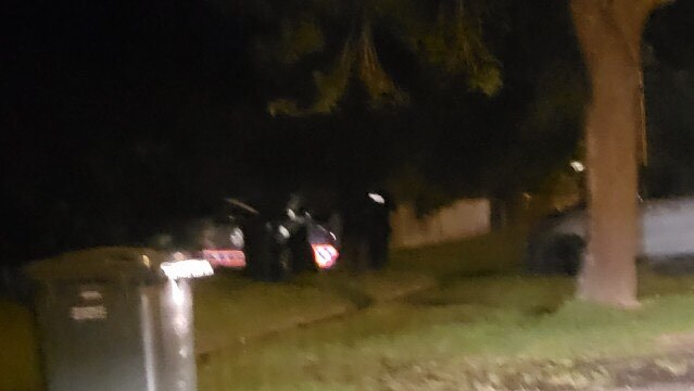 Police guard the home overnight.