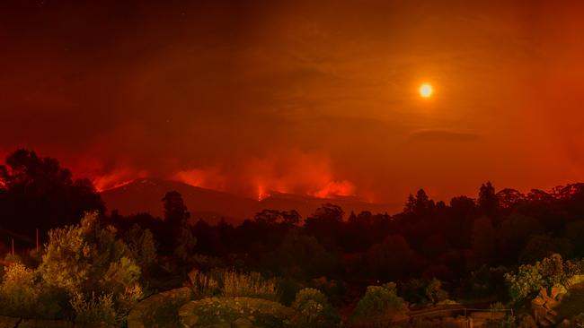 The fires behind the Mt Tomah Botanical Gardens, looking east towards Bilpin, in the early hours of Monday. Picture: Matrix