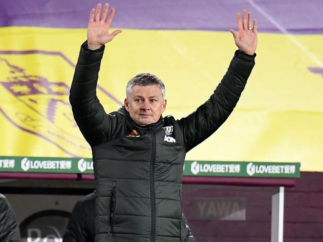 Manchester United's Norwegian manager Ole Gunnar Solskjaer reacts during the English Premier League football match between Burnley and Manchester United at Turf Moor in Burnley, north west England on January 12, 2021. - Manchester United won the match 1-0. (Photo by PETER POWELL / POOL / AFP) / RESTRICTED TO EDITORIAL USE. No use with unauthorized audio, video, data, fixture lists, club/league logos or 'live' services. Online in-match use limited to 120 images. An additional 40 images may be used in extra time. No video emulation. Social media in-match use limited to 120 images. An additional 40 images may be used in extra time. No use in betting publications, games or single club/league/player publications. /