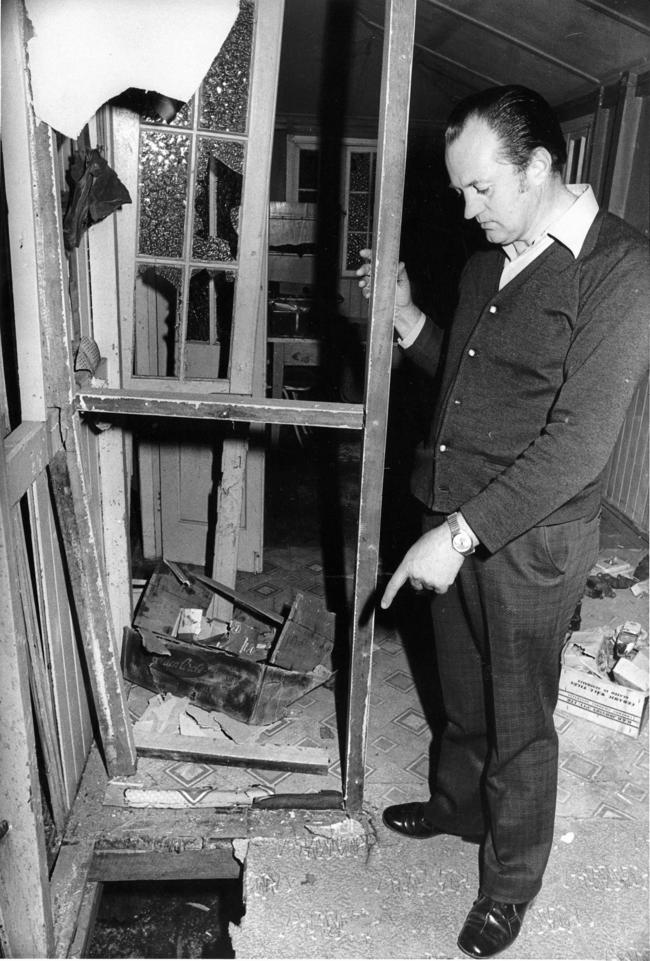 TARGET: Detective Sergeant Kevin Dorries inspects the scene of the bomb blast. The booby-trap was meant to kill him.