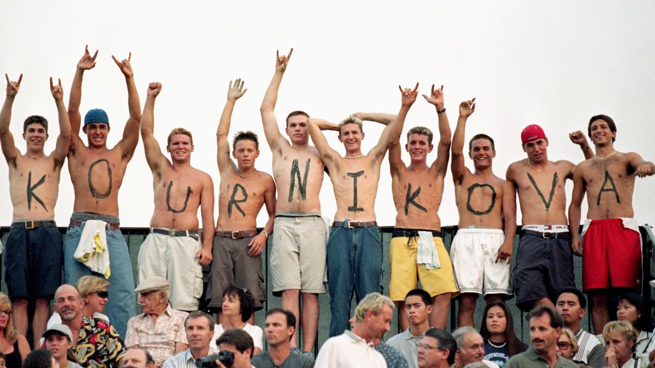 Fans of Anna Kournikova paint her name on their chests they cheer from the stands during the Acura Classic. Picture: Danny Moloshok /Allsport