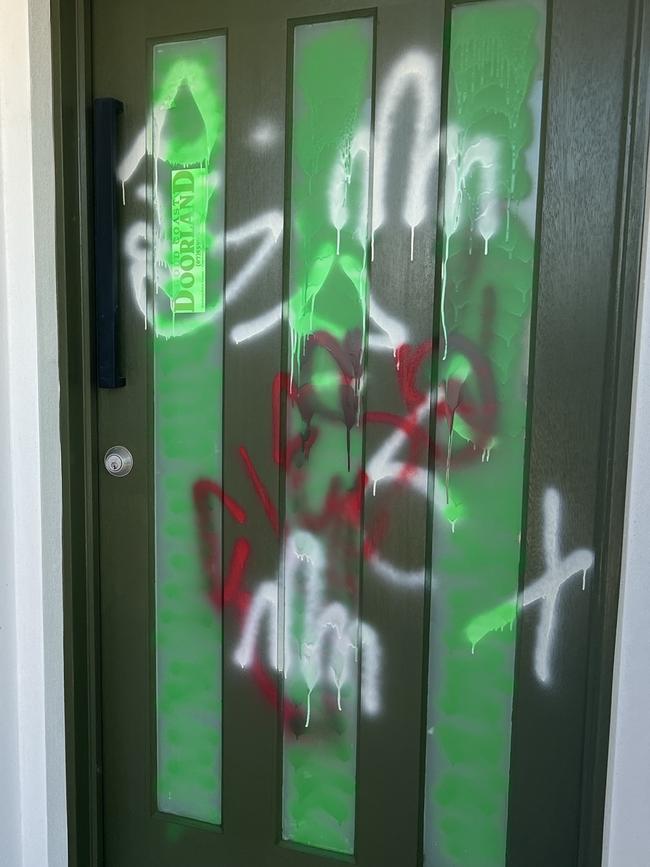 The front door of Ashlee Smallfield's newly built home, which was attacked by teen vandals before she and her family could move in. Picture: Supplied