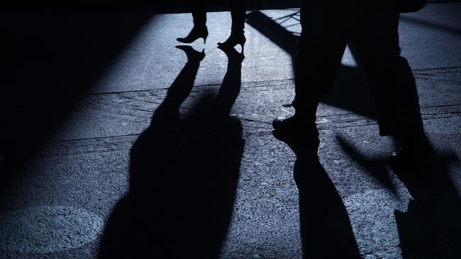 Stock image of a male following female in the dark night, a stalker. Picture: iStock