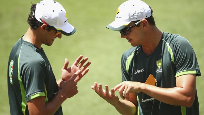 BRISBANE, AUSTRALIA - DECEMBER 16: Mitchell Starc and Josh Hazlewood of Australia talk during an Australian Nets Session at The Gabba on December 16, 2014 in Brisbane, Australia. (Photo by Ryan Pierse/Getty Images)