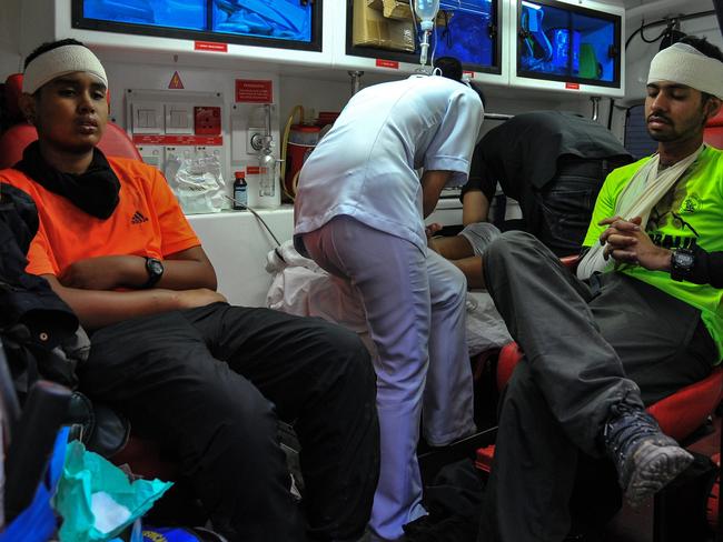 Suffering ... injured Singaporean students rest inside an ambulance after an earthquake in Kundasang, a town in the district of Ranau. Picture: AFP/Malaysia Information Ministry of Sabah