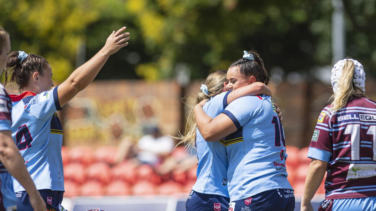 Western Clydesdales celebrate a try by Jessikah Reeves (right) against Central Queensland Capras.