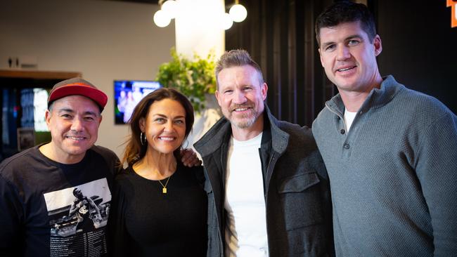 Sam Pang, Chrissie Swan and Jonathan Brown (far right) - pictured with AFL coach Nathan Buckley - quit their radio program.