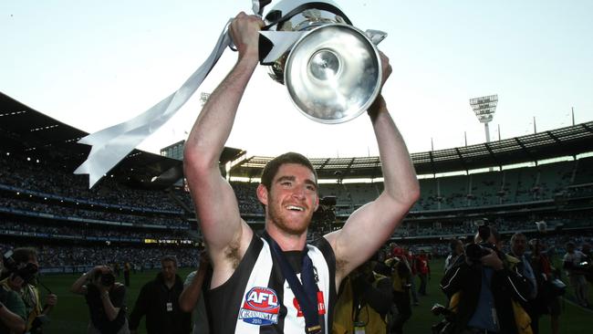 Tyson Goldsack enjoys the spoils of Collingwood’s 2010 grand final victory.