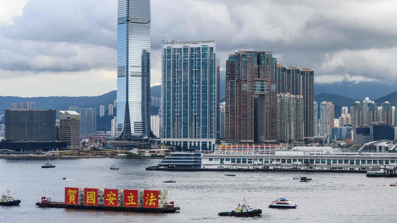 A barge in Hong Kong’s Victoria Harbour with banners that read “Celebrate the National Security Law” last week. Picture: Anthony WALLACE / AFP.