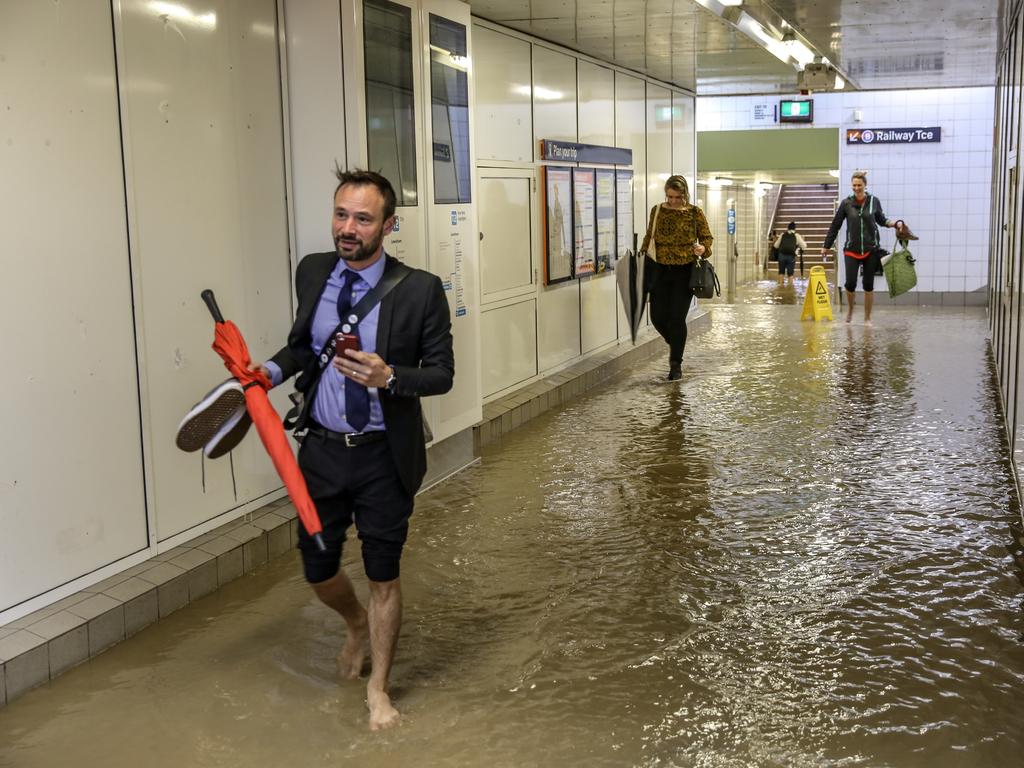 Commuters struggle against torrential rain and gale force winds in Lewisham as Sydney is lashed with a monumental early summer storm, 28/11/18. Picture: Nicholas Eagar