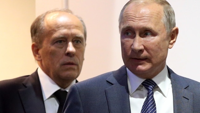 Ukrainian defence intelligence have identified Federal Security Service Chief Alexander Bortnikov (Left) as a potential successor to President Vladimir Putin (Right). Picture: Getty