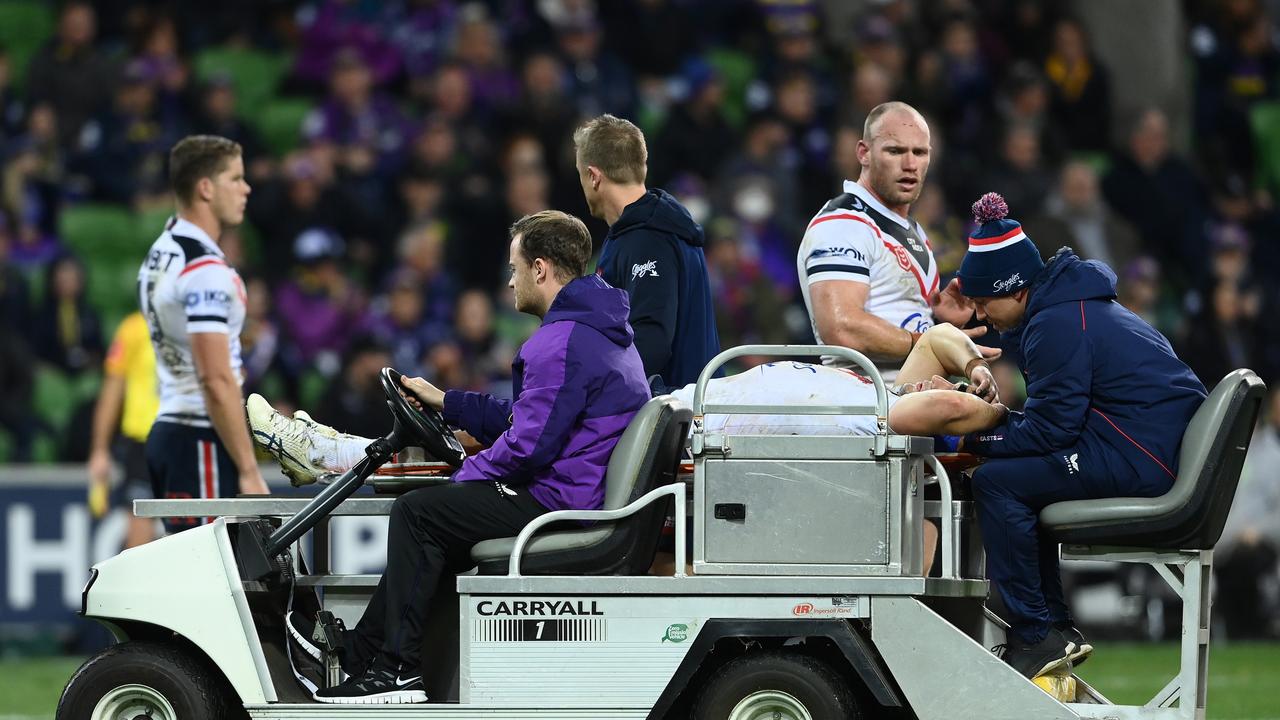 Victor Radley of the Roosters was taken off the field by stretcher after his tackle went wrong. Picture: Quinn Rooney/Getty Images