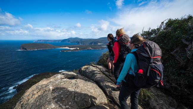 SUNDAY ESCAPE. NEW WALKS AROUND THE WORLD. Walkers head out to the Blade at Cape Pillar on Day 3 of the Three Capes Lodge Walk. Picture: Tasmanian Walking Company