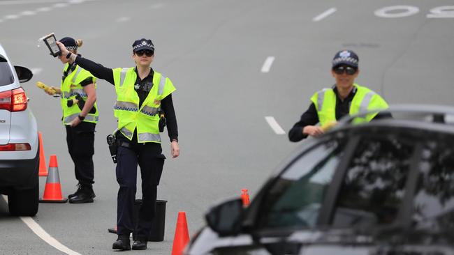 Police conduct a random breath testing operation.