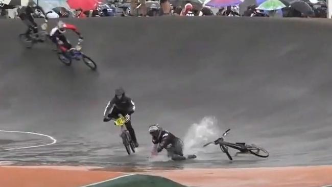 Riders tumble and spill on the Sam Willoughby International BMX with water on the track proving problematic. Picture AusCycling