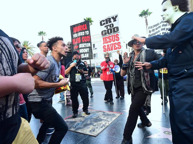 A scuffle breaks out as tempers flare around Trump’s vandalised star on Hollywood Boulevard a week ago. Picture: Frederic J. Brown/AFP