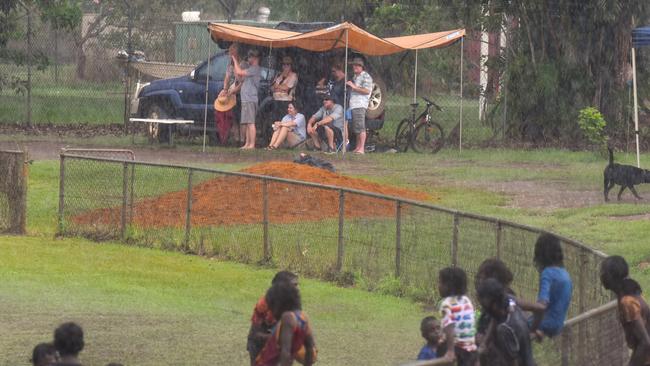 A group of tourists huddled together during the storm. Picture: Darcy Jennings