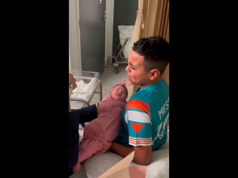Heartwarming moment brother meets his little sister for the first time
