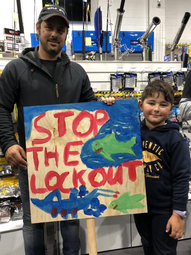 Joseph Camilleri, 6, and his father Daniel at the Stop the Lockout meeting in Mona Vale protesting a proposed marine park expansion on the northern beaches.