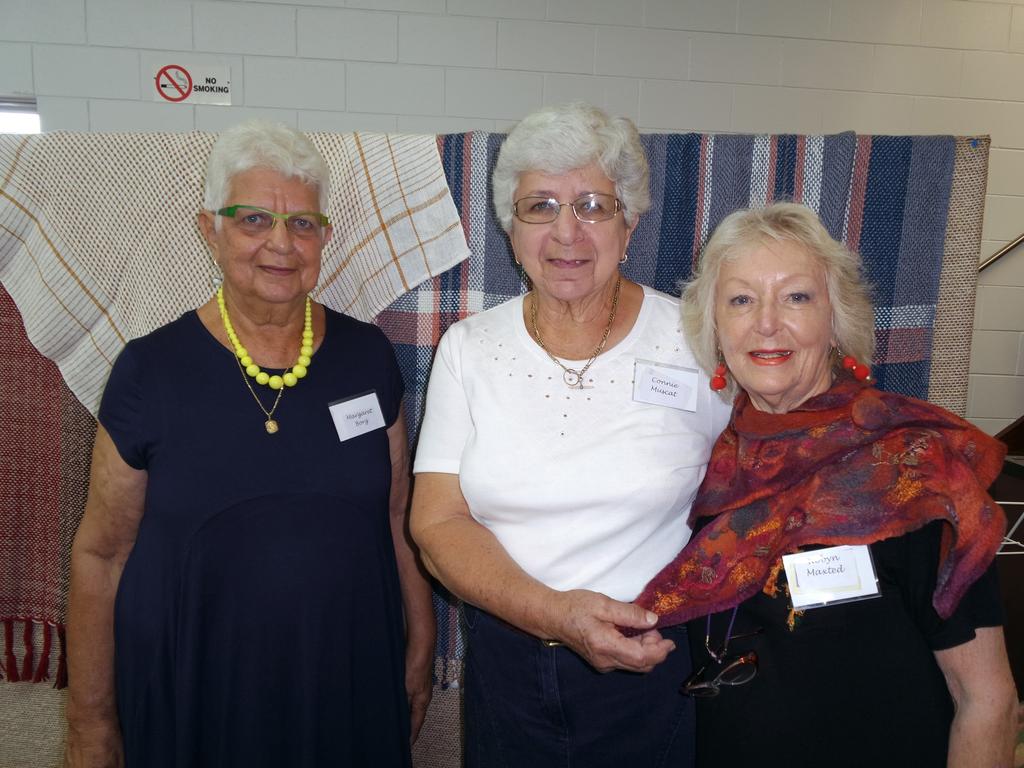 Margaret Borg (president of Valley Spinners and Craft Group Inc. with Connie Muscat and Robyn Maxted standing in front of some of the hand-woven articles created by members.