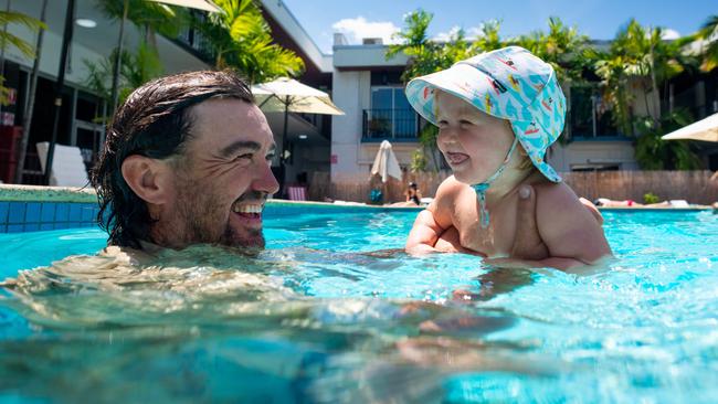 Matt Wright goes for a swim with baby Banjo at The Cav in Darwin ahead of his second Father’s Day. Picture: Che Chorley