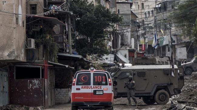 An Israeli soldier gestures towards a Palestinian Red Cross ambulance at the entrance of the Tulkarem refugee camp in Tulkarem in the West Bank. Picture: AFP