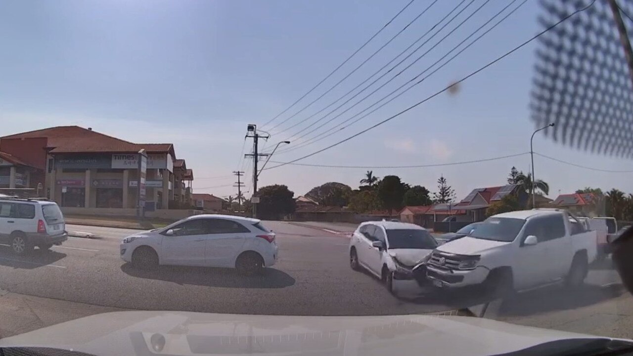 A white hatchback is hit by a ute as it tries to cross three lanes of traffic at Sunnybank.