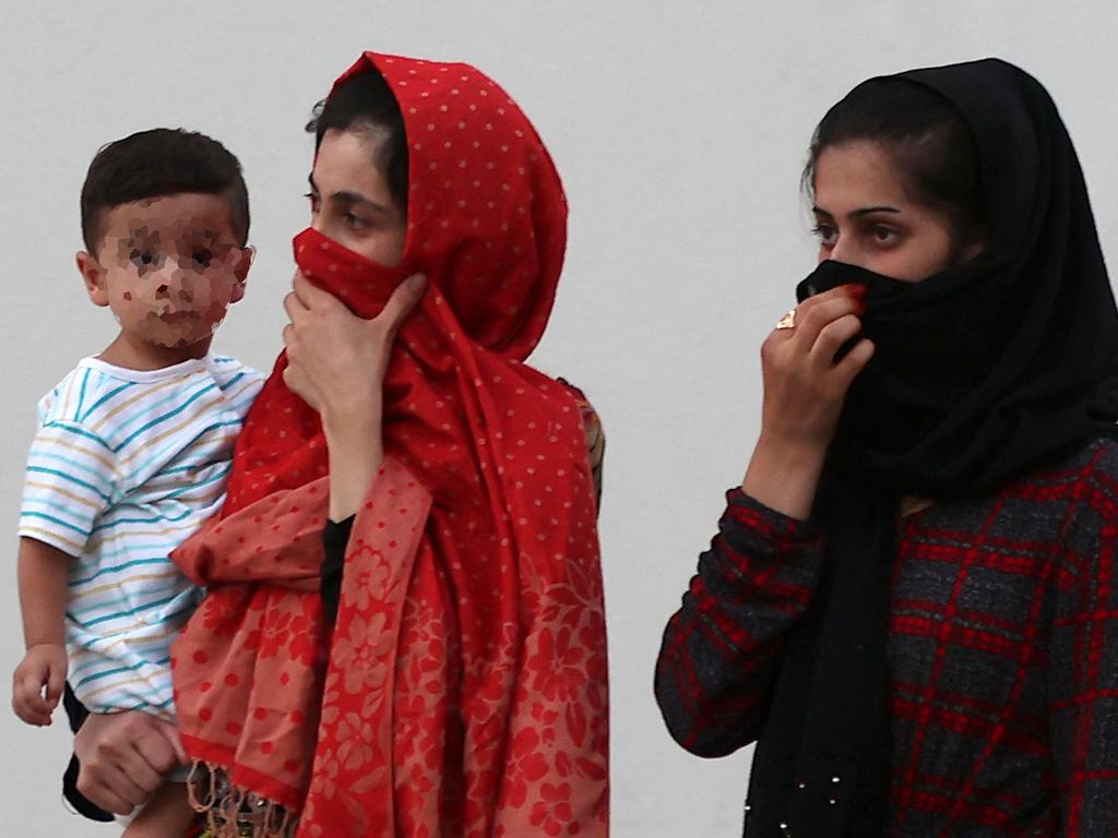 Afghan women and a child inside a villa complex near the centre of the Qatari capital Doha, where refugees who recently arrived from Afghanistan began to settle. Picture: AFP