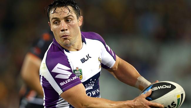 SYDNEY, AUSTRALIA - AUGUST 04: Cooper Cronk of the Storm looks to pass during the round 21 NRL match between the Wests Tigers and the Melbourne Storm at Campbelltown Sports Stadium on August 4, 2014 in Sydney, Australia. (Photo by Renee McKay/Getty Images)