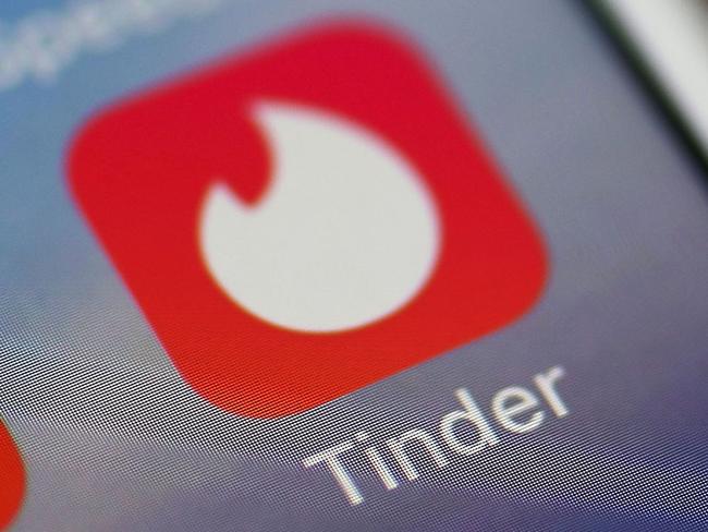(FILES) In this file photo illustration taken on August 14, 2018, the icon for the dating app Tinder is seen on the screen of an iPhone in Miami, Florida. - Tinder announced on January 23, 2020, that US users would soon have a 