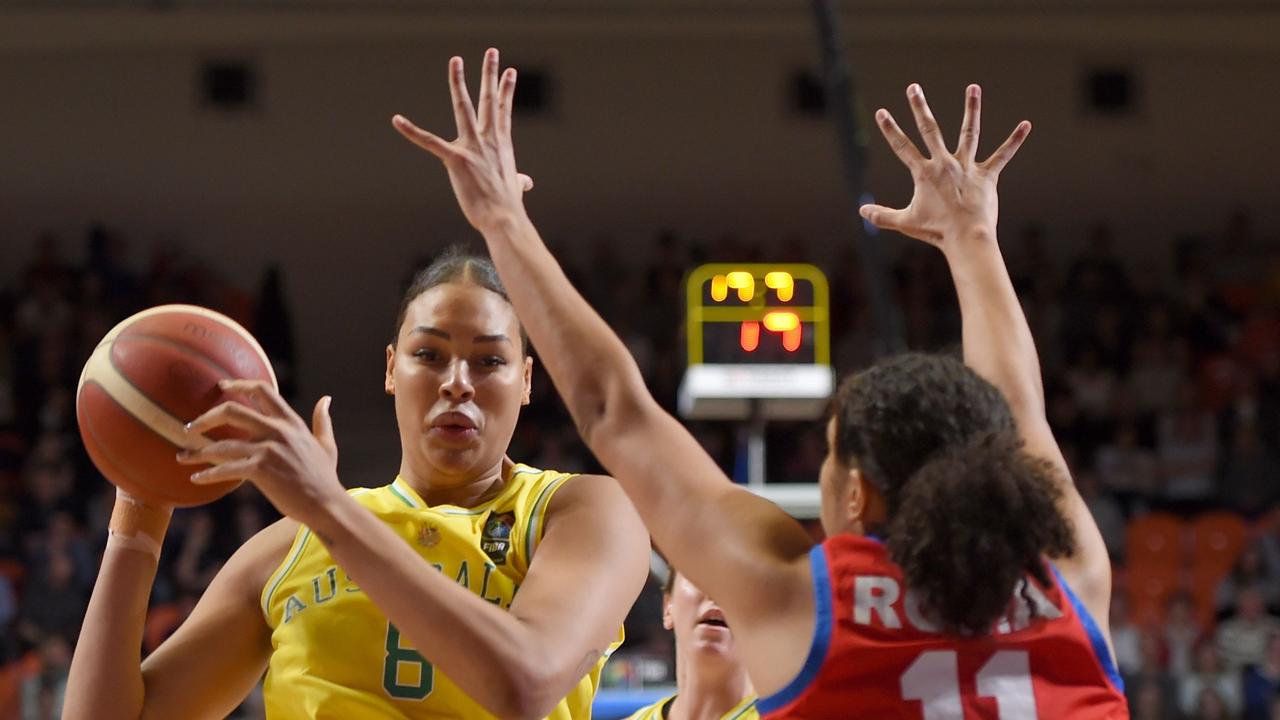 Australian's pivot Liz Cambage (L) fights for the ball with Puerto Rico's wing Sofia Roma (R) during the FIBA Women's Olympic Qualifying Tournament match between Australia and Puerto Rico, on February 8, 2020, at the Prado stadium in Bourges, Center France. (Photo by GUILLAUME SOUVANT / AFP)