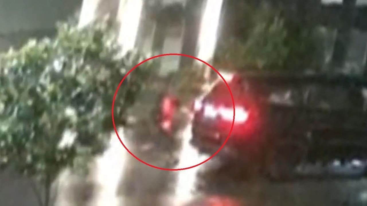 One of the two men is seen racing back to the vehicle shortly after the alleged shooting. Picture: Supplied / Channel 9