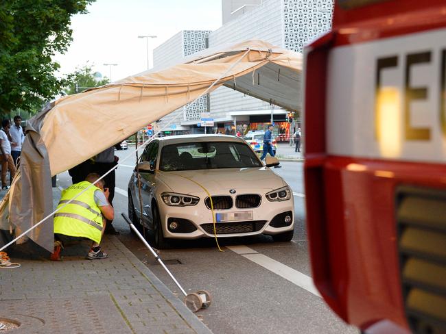 Police investigates the car which stopped the suspect who attacked people with a machete in Reutlingen, southwestern Germany. Picture: AFP