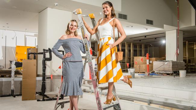 Models Chelsea Scanlon, wearing Studio by Preen gingham top and skirt, shoes by Faith, and Anna McEvoy, wearing J By Jasper Conran skirt, tops, shoes and bag, at the construction site of the soon-to-be-opened Debenhams store. Picture: Eugene Hyland