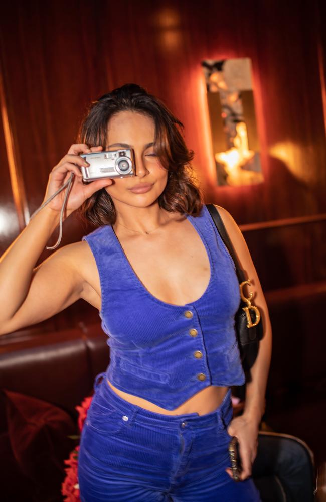 Jade Myriam strikes a pose with her great grandfather’s antique camera. Picture: Rolla's