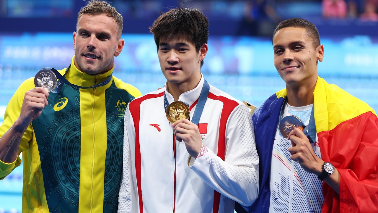 Gold medalist Pan Zhanle with Australia’s Kyle Chalmers and Romania’s David Popovici. Picture: Getty Images