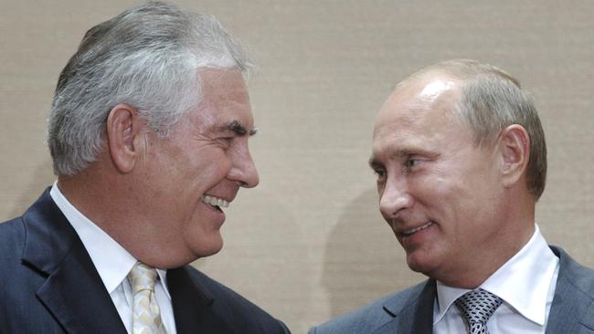 Tillerson, left, with Vladimir Putin in 2011.