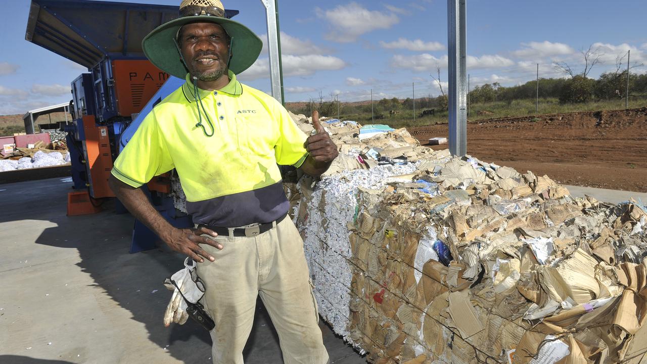 ASTC worker Elwin Lillias at the new waste paper bailer at the tip in Alice Springs.