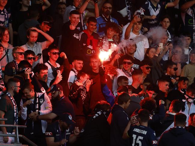 A flare being lit by Victory fans in the stands at AAMI Park Picture: Darrian Traynor/Getty Images
