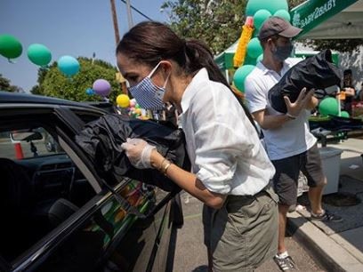 Meghan Markle and Prince Harry volunteer at a school charity drive in Los Angeles. Picture: Instagram