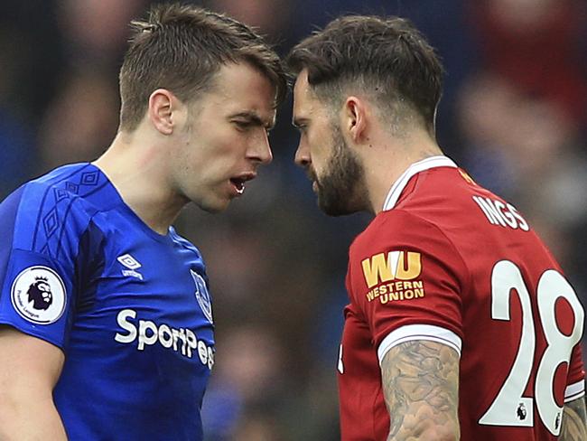 Liverpool's Danny Ings, right, and Everton's Seamus Coleman. (Peter Byrne/PA via AP)