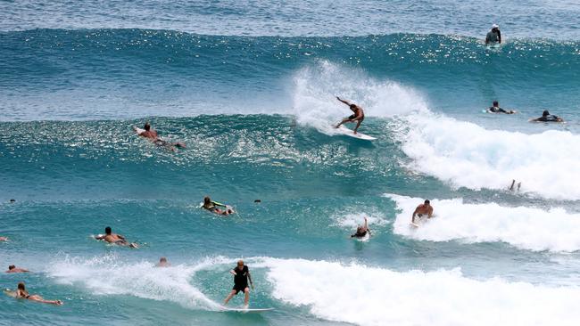 Rainbow Bay is popular among surfers and beachgoers alike. Photo by Richard Gosling