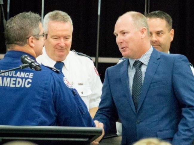 Rouse Hill Anglican College teacher Paul Kennedy, right, congratulated by Acting Supt Brian Parsell.