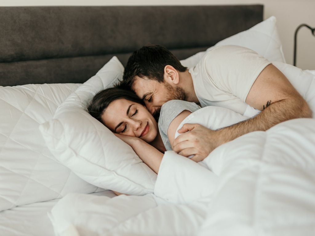 If your partner's weird work hours or constant turning is driving you mad, you might want to rethink getting an innerspring mattress. Picture: iStock/Studio4.