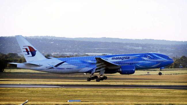 Malaysia Airlines will resume flights to Adelaide in July. Pictured is the first international flight to arrive at Adelaide Airport's new terminal in October, 2005, a Malaysia Airlines aircraft. Picture: Sam Wundke