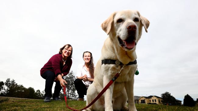 University of Adelaide researchers Dr Susan Hazel and Dr Anne-Lise Chaber with a pet dog.