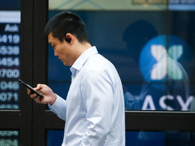 SYDNEY, AUSTRALIA - Newswire Photos October 31, 2022: Members of the public are seen walking past the ASX in Sydney. Picture: NCA Newswire / Gaye Gerard